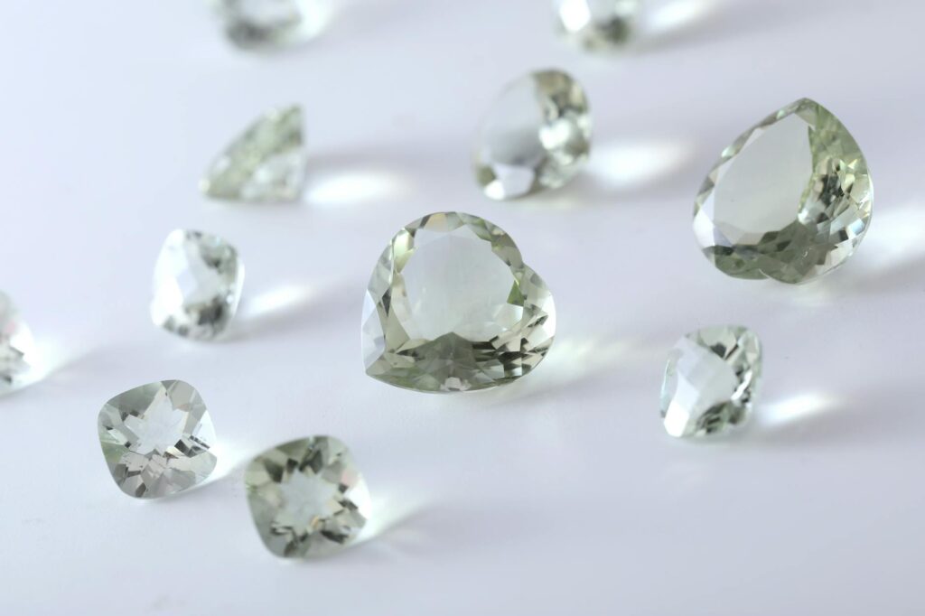 clear gemstone on white surface