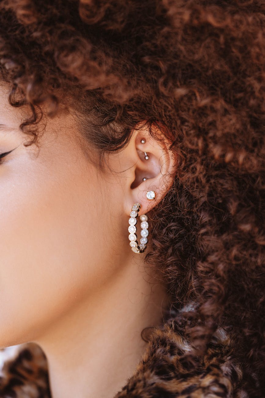 a close up shot of a woman wearing earrings